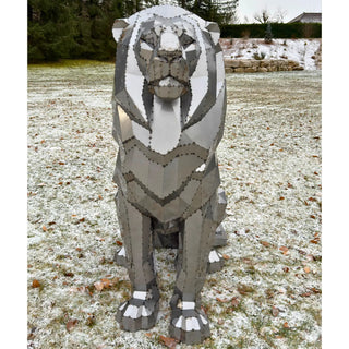 Sculpture d'art en métal d'un lion en acier fabriquée par l'artiste Cyril Maire