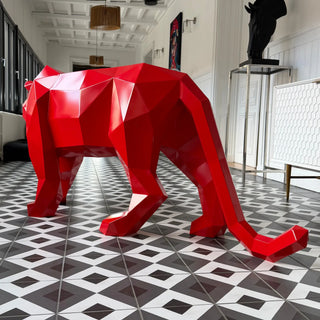 Sculpture d'art en acier d'un tigre peint en rouge fabriquée par l'artiste Cyril Maire