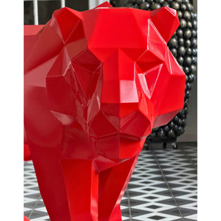 Sculpture d'art en acier d'un tigre peint en rouge fabriquée par l'artiste Cyril Maire